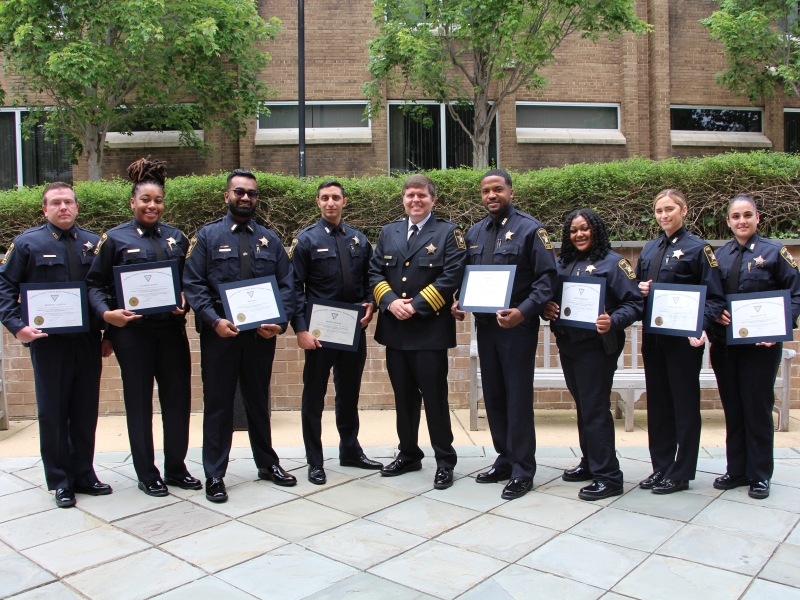  several uniformed deputies holding certificates