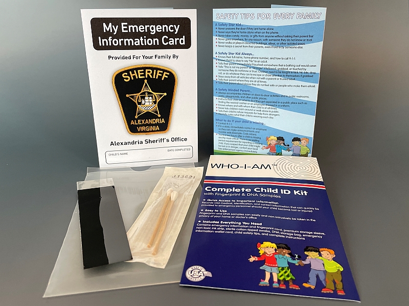 emergency information card with Sheriff's Office log, safety types for families, a black strip, two cottons swabs and an printed child identification kit