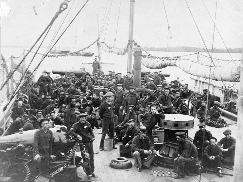 USS Miami crew - black and white photo of large crew on deck of sailing ship