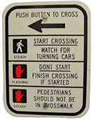 A photo of a "push button to cross"  in Alexandria