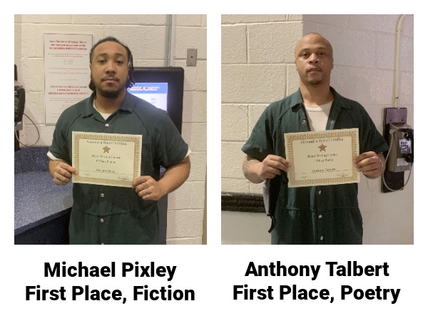 two men holding certificates for winning writing contest 