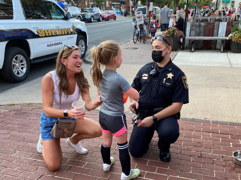 deputy speaks with child and her mother