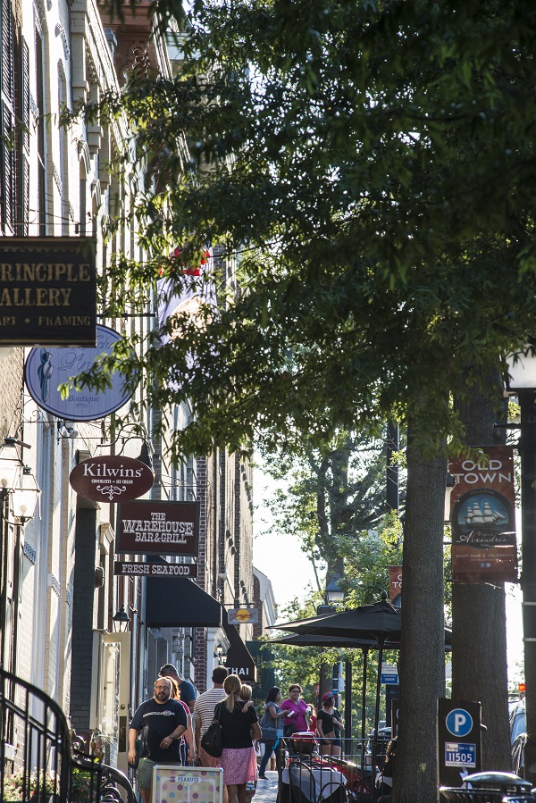 Photo of people walking by retail stores in the 100 block of King Street