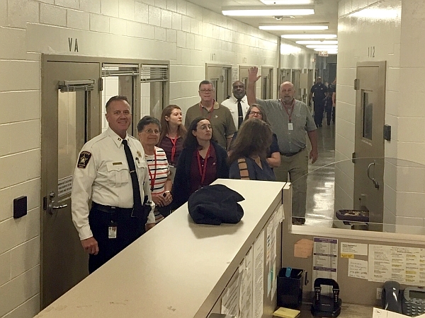 community academy members on tour of jail