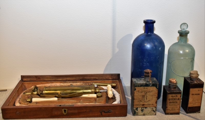 A Stomach Pump, Medicine Jars and Tins 