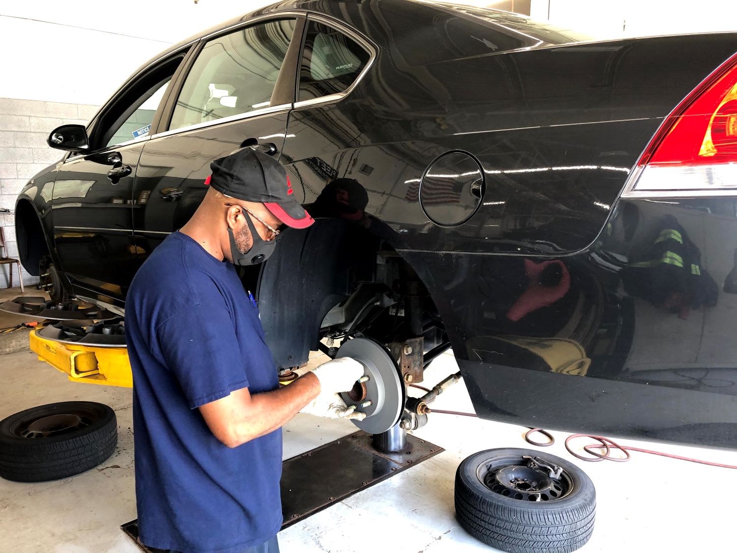 A Fleet Services technician works on a City vehicle