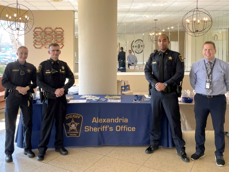 deputies in front of table with Alexandria Sheriff's Office markings