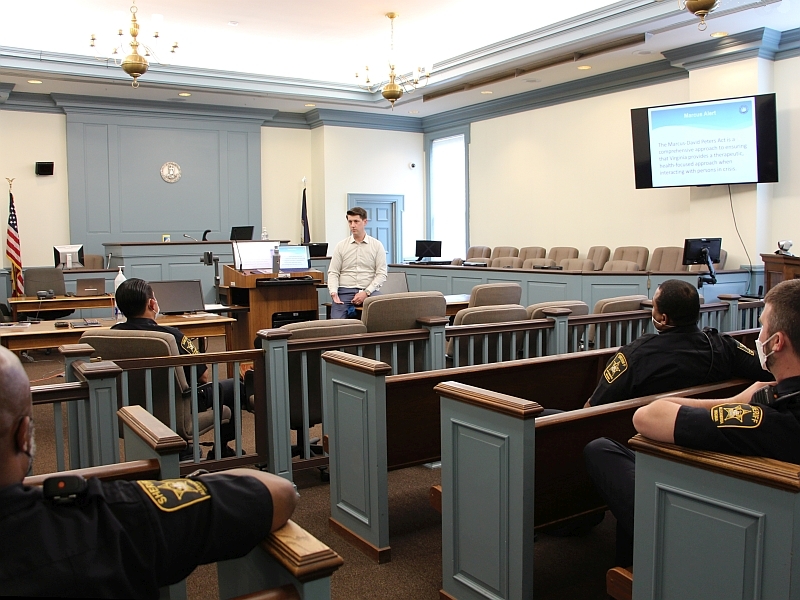 deputies in courtroom with civilian providing training