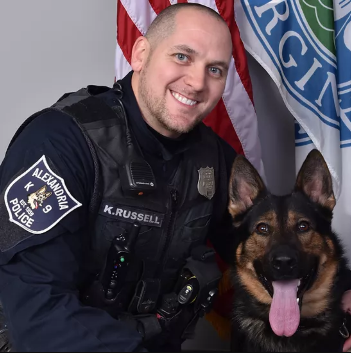 Russell (in uniform) and a canine officer