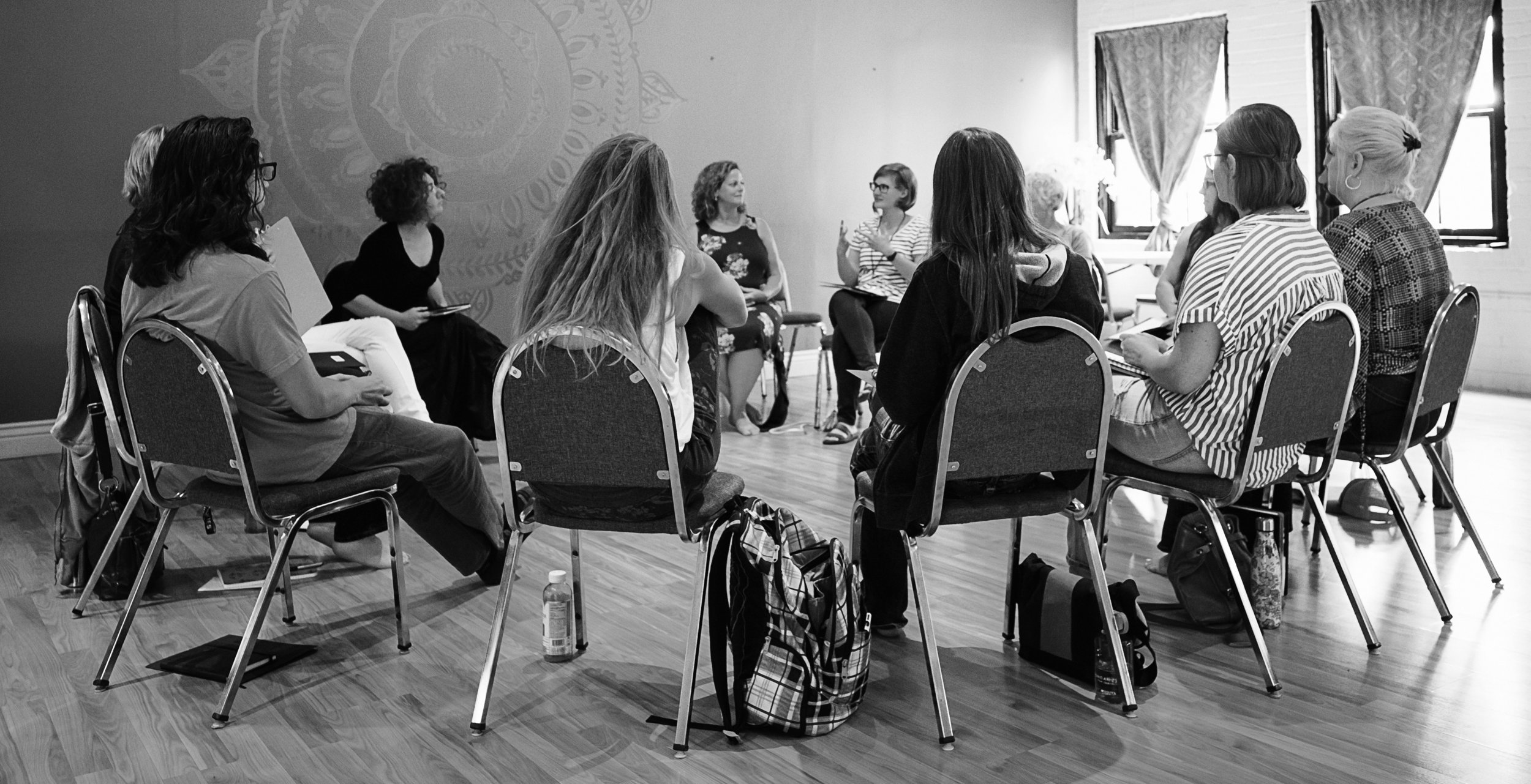 Group of volunteers sitting in a circle