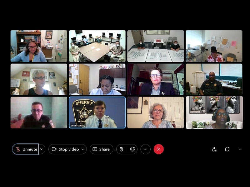screen capture of a web based meeting showing 12 screen views of inmates, community members and Sheriff's Office staff
