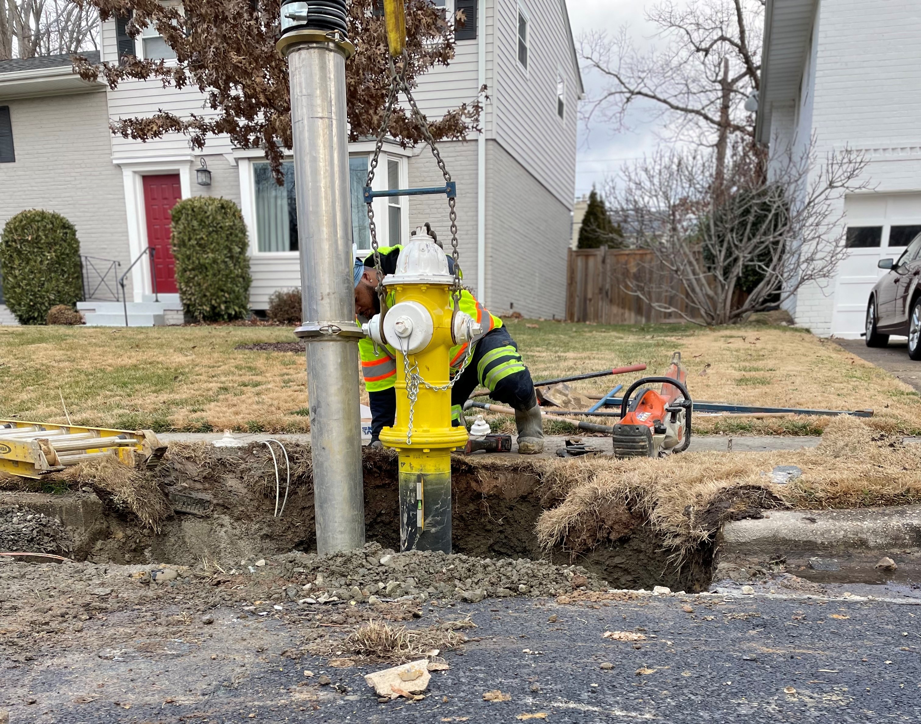Photo of TES crews performing hydrant maintenance. 