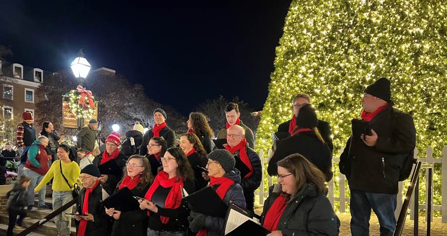 The Alexandria Choral Society performing in front of Alexandria's holiday tree