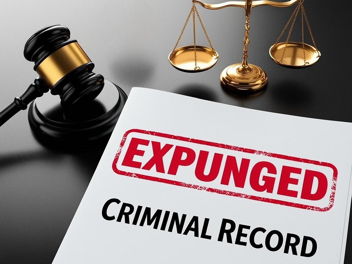 Gavel, scales of justice and a white document labled Criminal Record with Expunged in red lettering