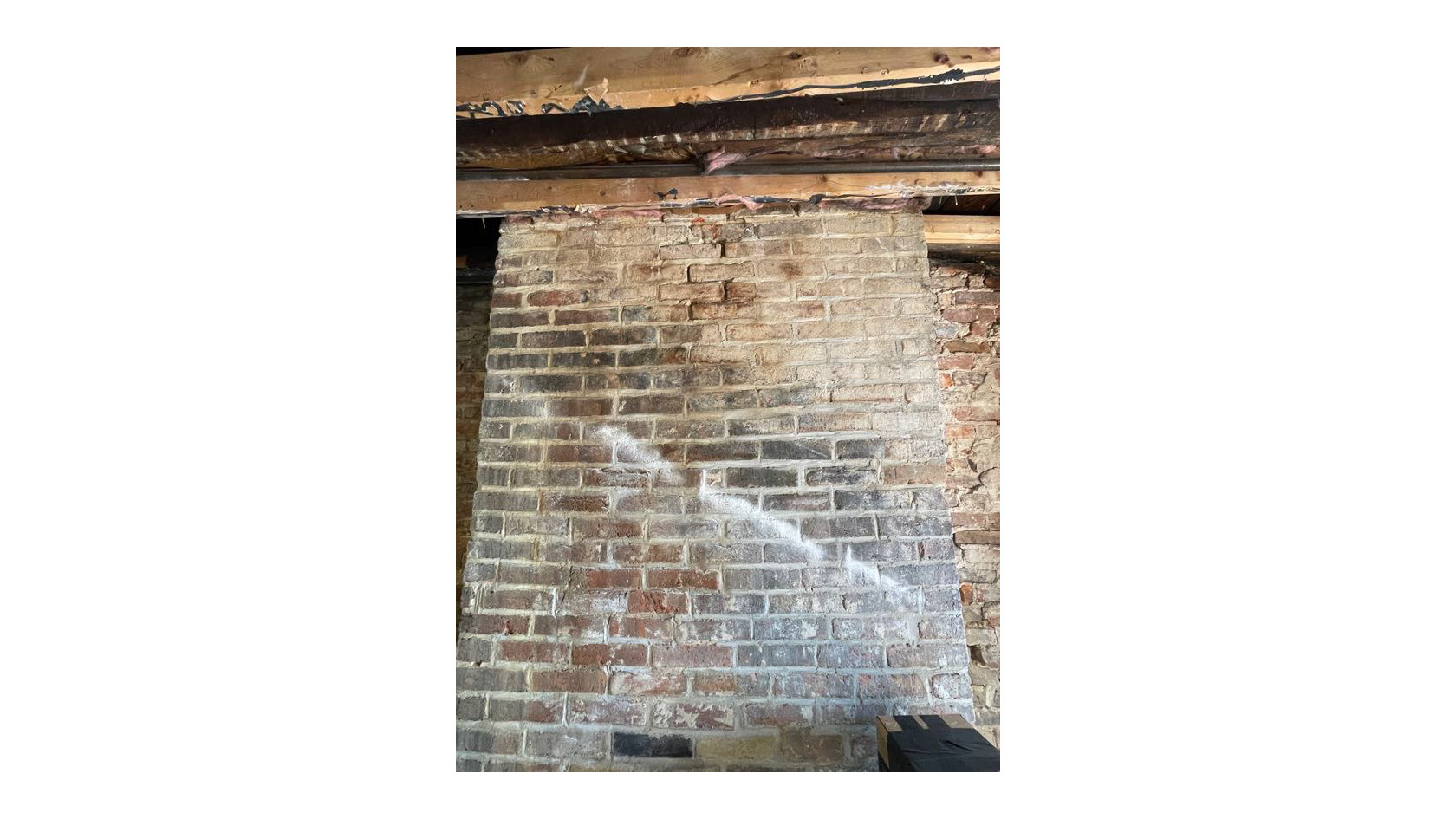 white chalk line showing slope of original rafters