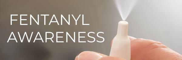 Fentanyl awareness banner with photo of hand spraying naloxone nasal spray