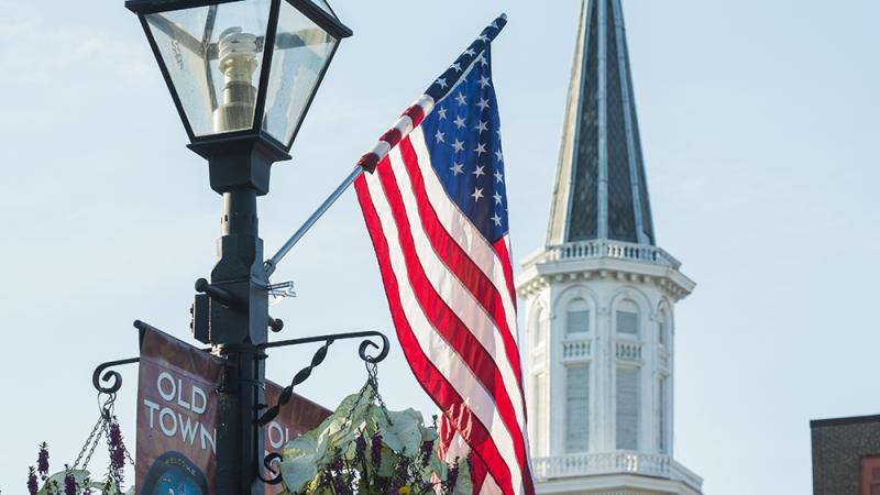 CIty Hall Clock Tower and American Flag photo