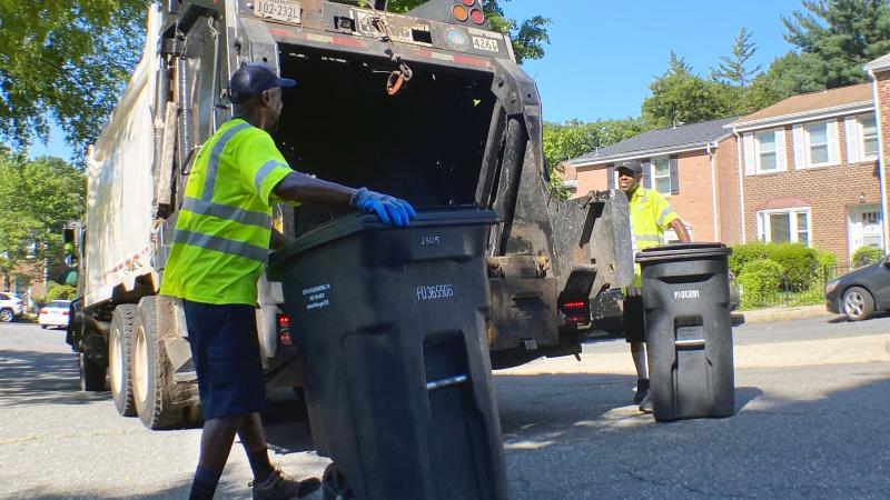 City crews collecting trash carts
