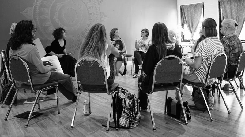 Group of volunteers sitting in a circle