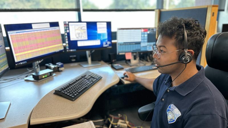 Male 911 Call taker at console