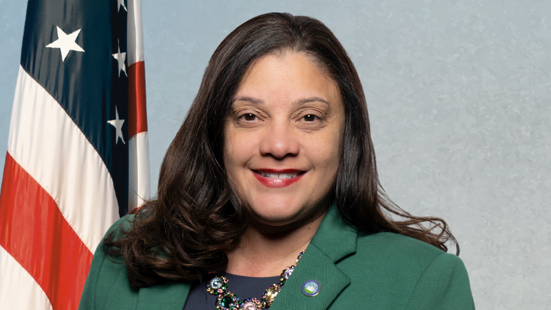 councilwoman greene on blue background with american flag