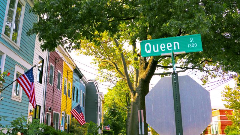 Queen Street Sign and Houses in Background