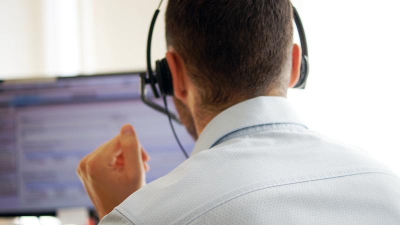 Call center worker at computer
