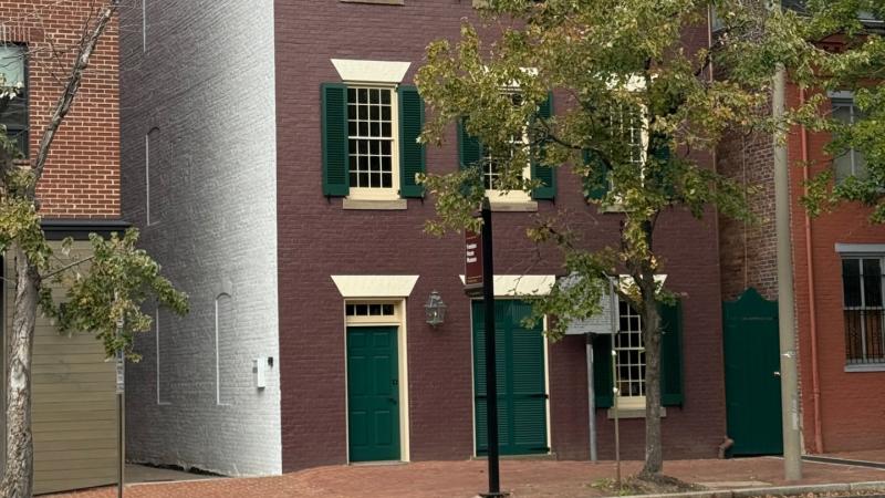 Freedom House Museum after exterior renovation, with dark red paint and green shutters