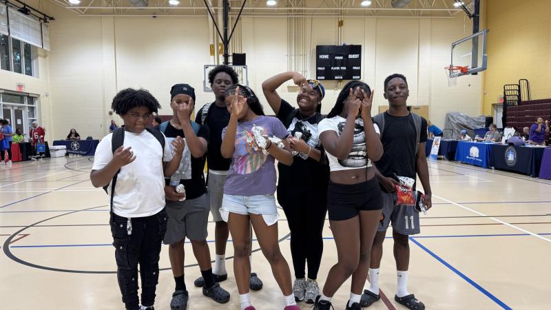 Teenagers posing for the camera inside the Charles Houston Rec Center