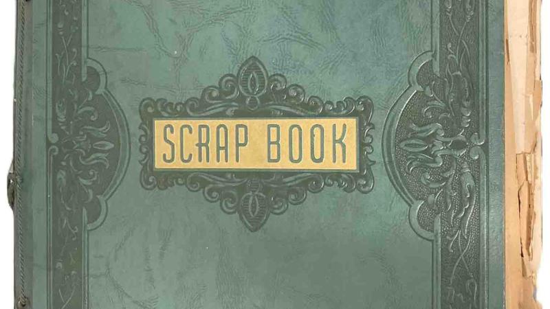 The embossed green cover is labeled SCRAP BOOK in green on gold.