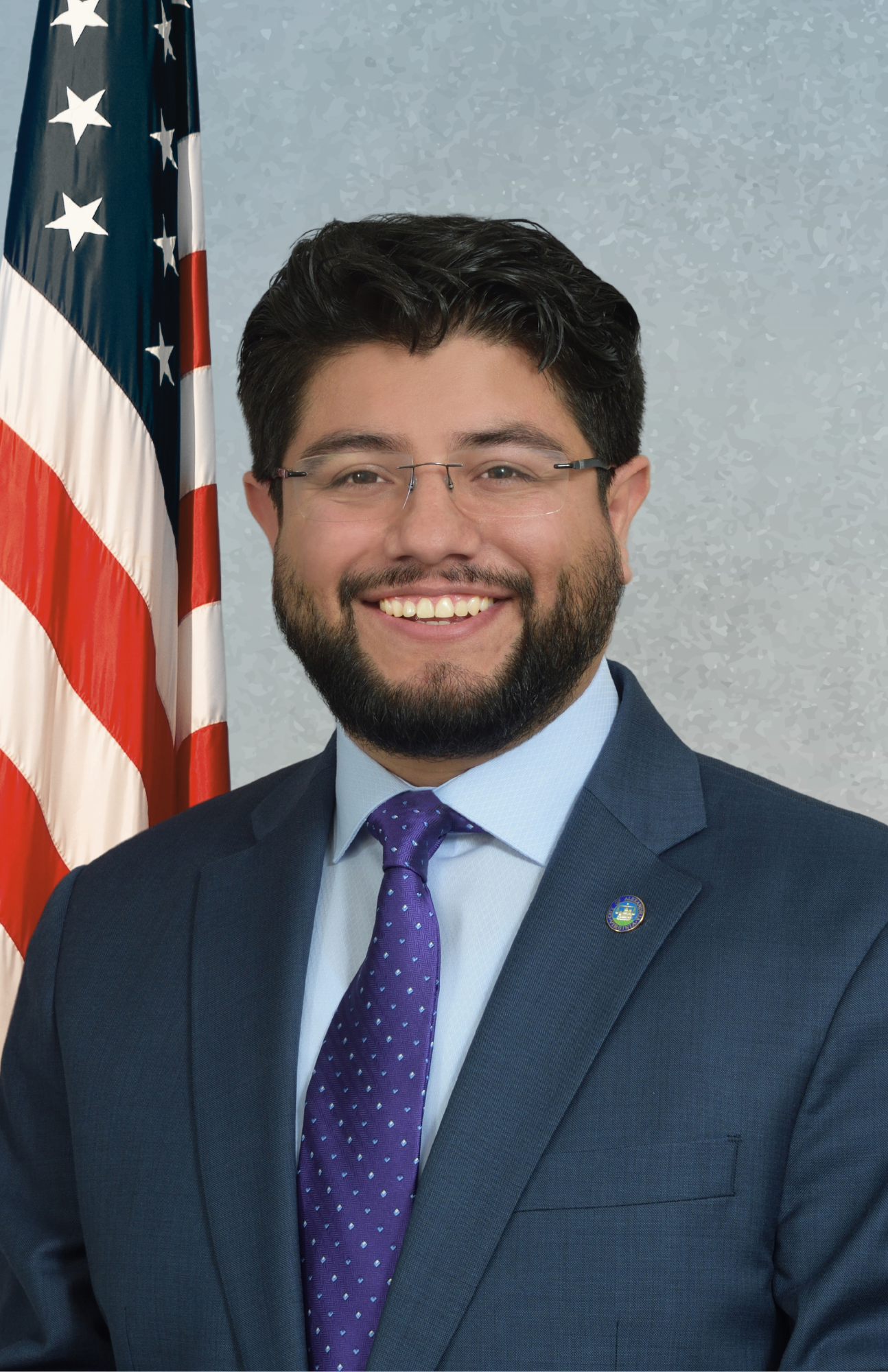 councilman aguirre on blue background with american flag