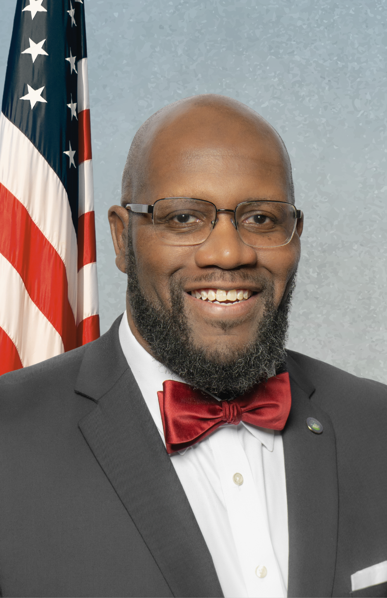 councilman chapman on blue background with american flag