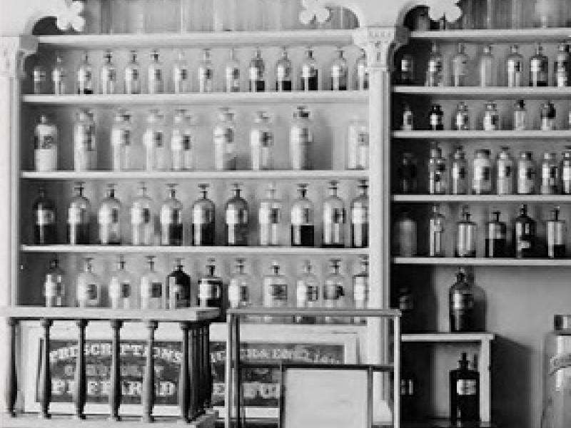 Apothecary retail shelving with glass bottles