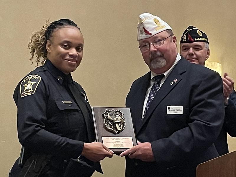 deputy accepting an award from an official from American Legion