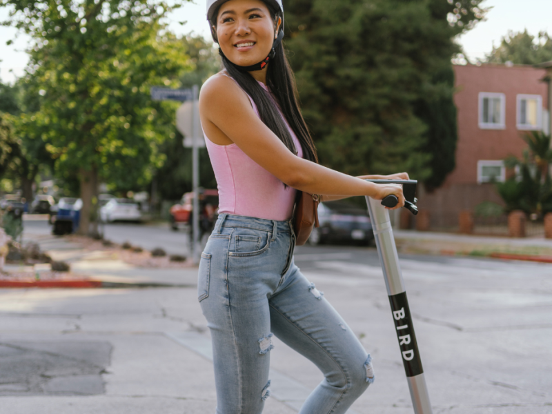 woman on bird scooter
