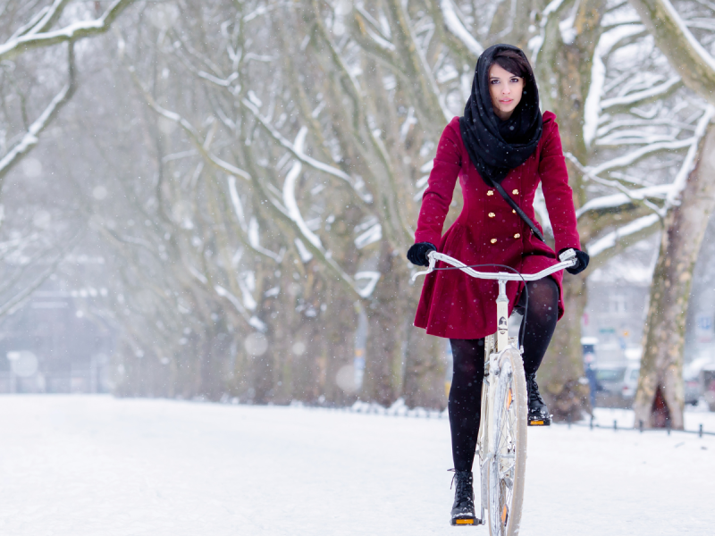 woman riding bike in snow
