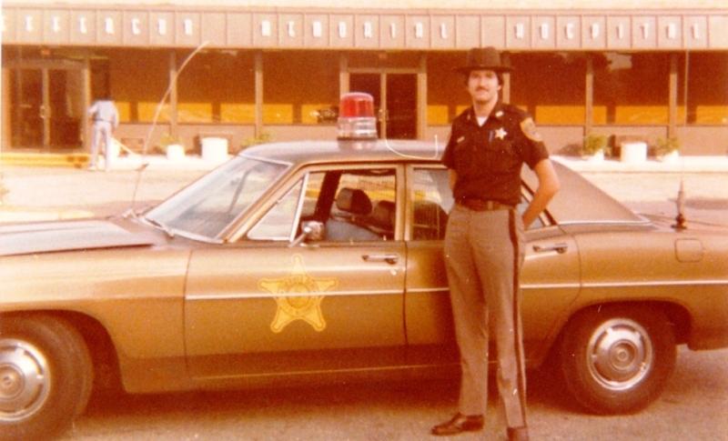 Deputy with brown cruiser in 1970s