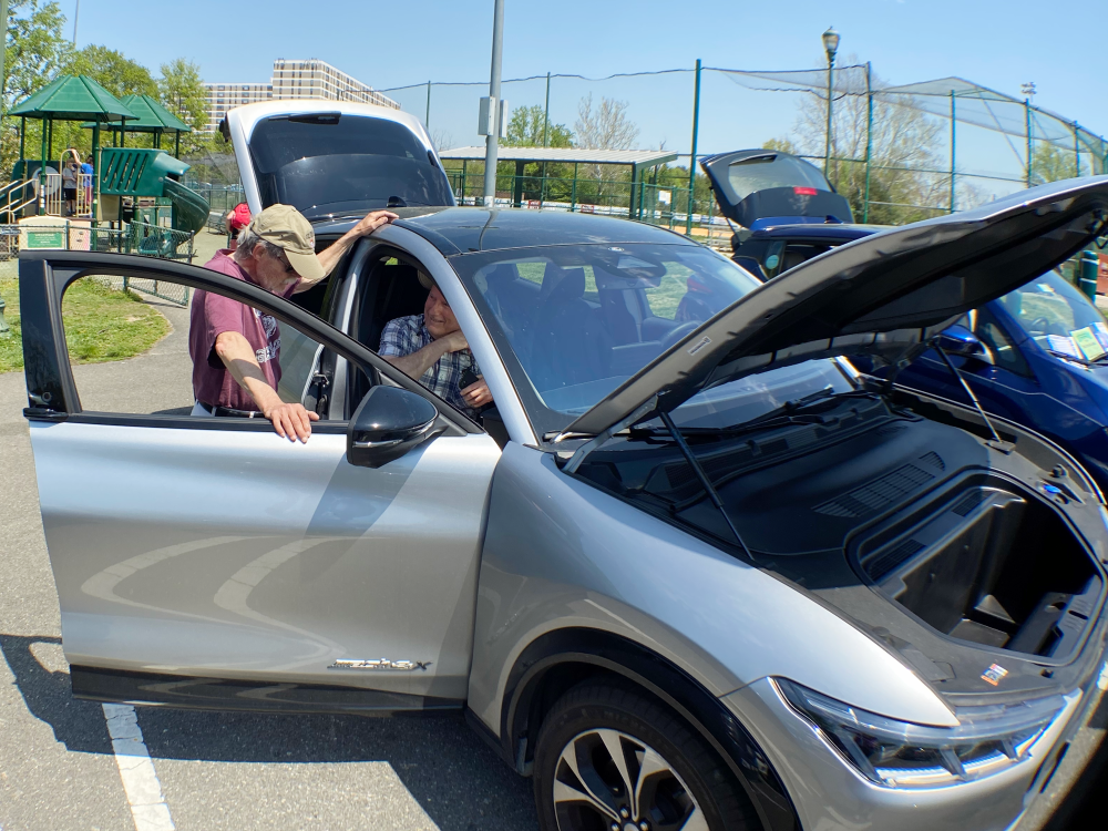 A tour of an eletric vehicle at the 2022 Cycling and Seedlings Earth Day event