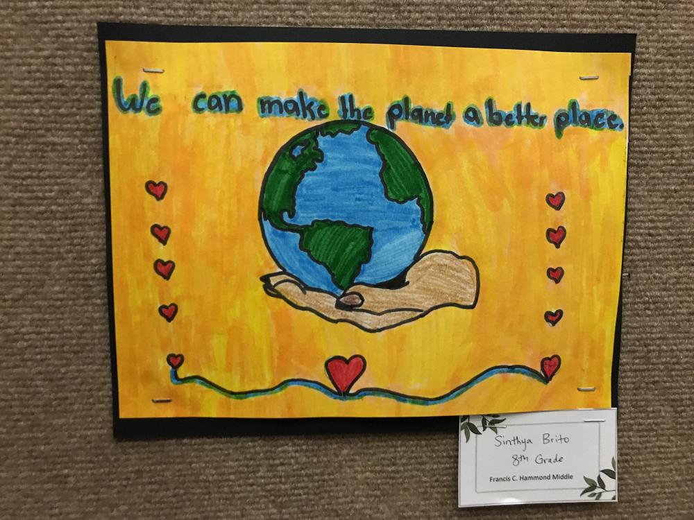 2022 Earth Day student art contest submission  (drawing of hand holding globe with text "We can make the planet a better place.")
