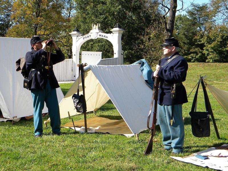 Reenactors with tents and camp equipment at Fort Ward's Civil War Camp Day
