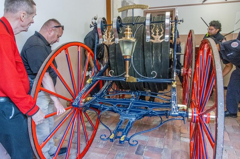 The hose reel moves into position in the museum