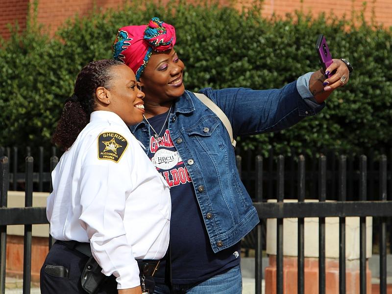 community member taking a selfie with a member of the sheriff's command staff