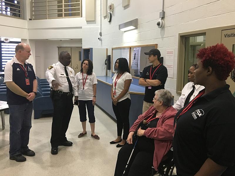 uniformed commanders give tour of housing unit in jail