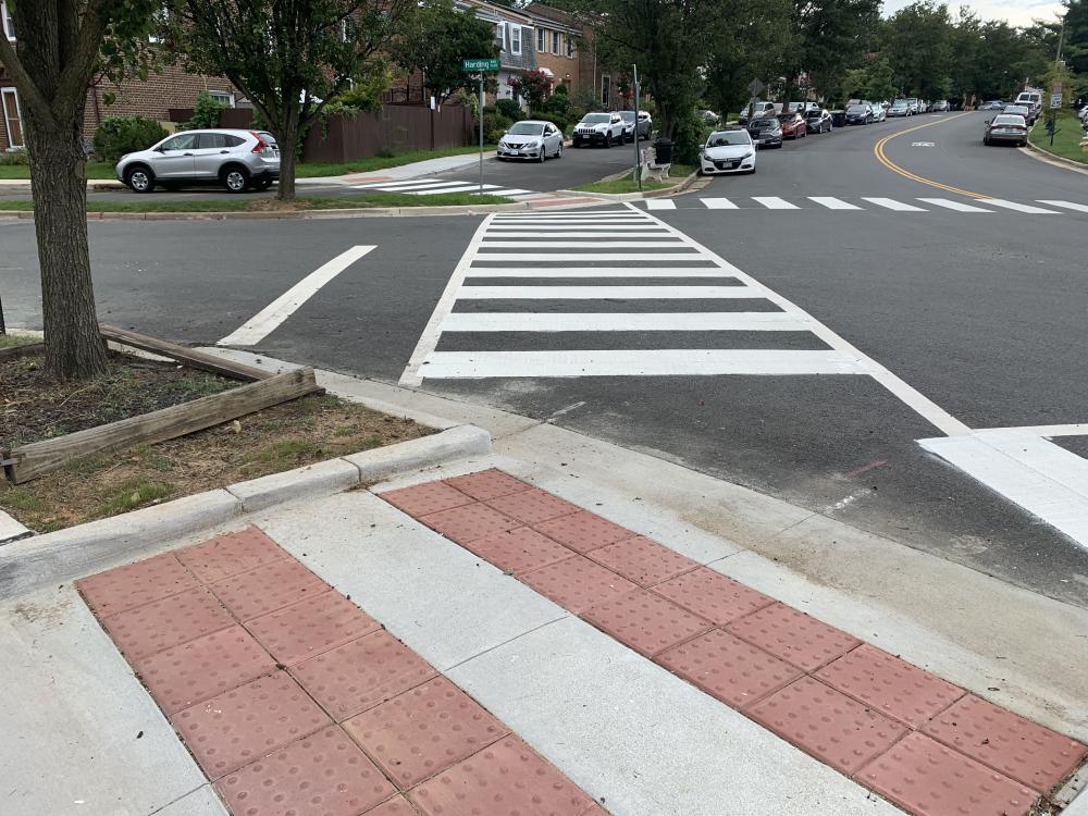Photo of a pedestrian crosswalk and accessible median refuges on Rayburn Avenue.