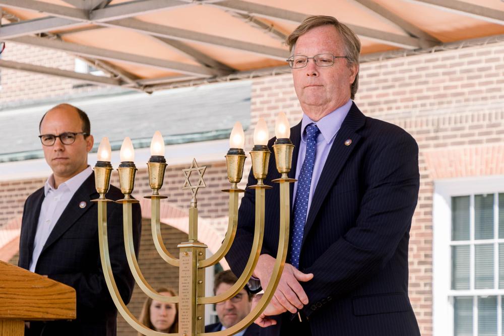 Mayor Wilson with City Manager Parajon and Menorah brass candles