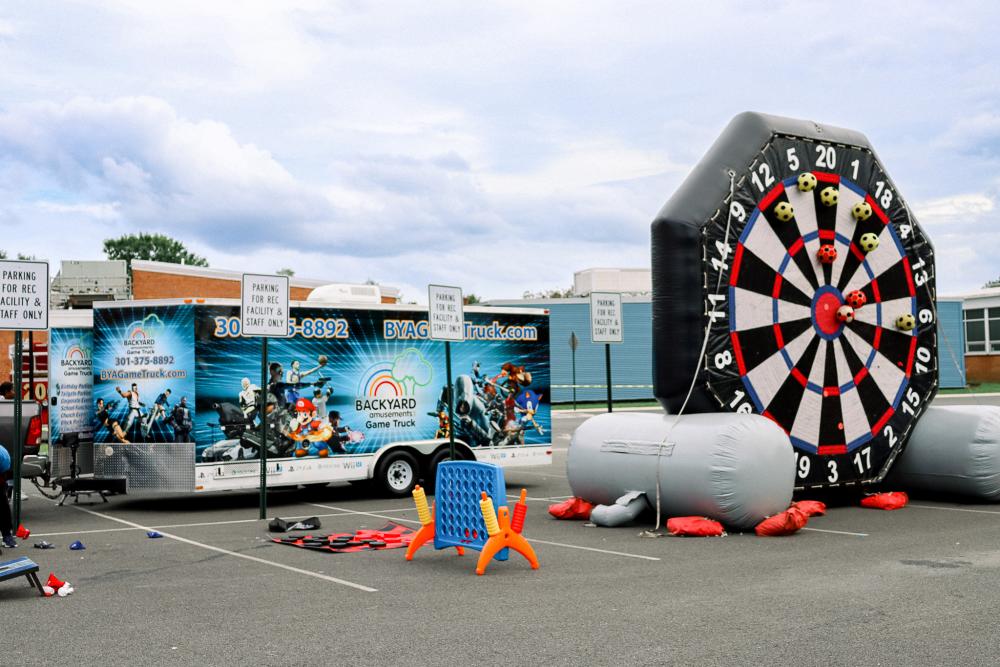 Image of the game truck and blow up soccer dart