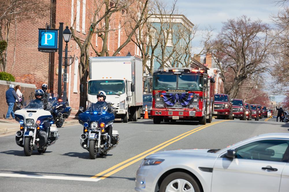 The funeral procession for Medical Services Deputy Chief Brian Hricik passes by City Hall on Saturday, March 11, 2023.