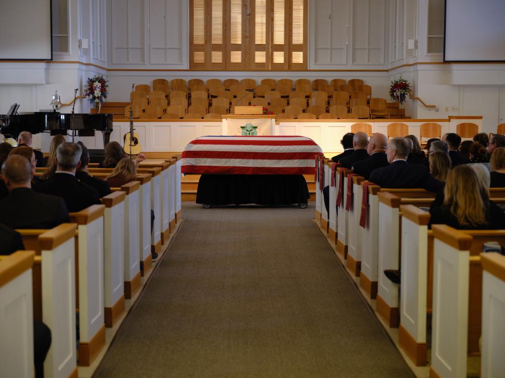 Friends, family, and colleagues fill the sanctuary at Vienna Presbyterian Church for Deputy Chief Brian Hricik's memorial service on Saturday, March 11, 2023.