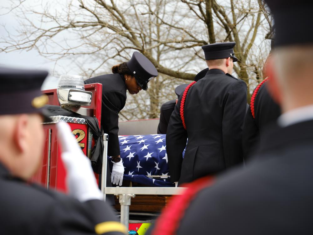 A multi-jurisdictional public safety honor guard moves Deputy Chief Hricik to the carriage of Engine 201 after his memorial service on Saturday, March 11, 2023.