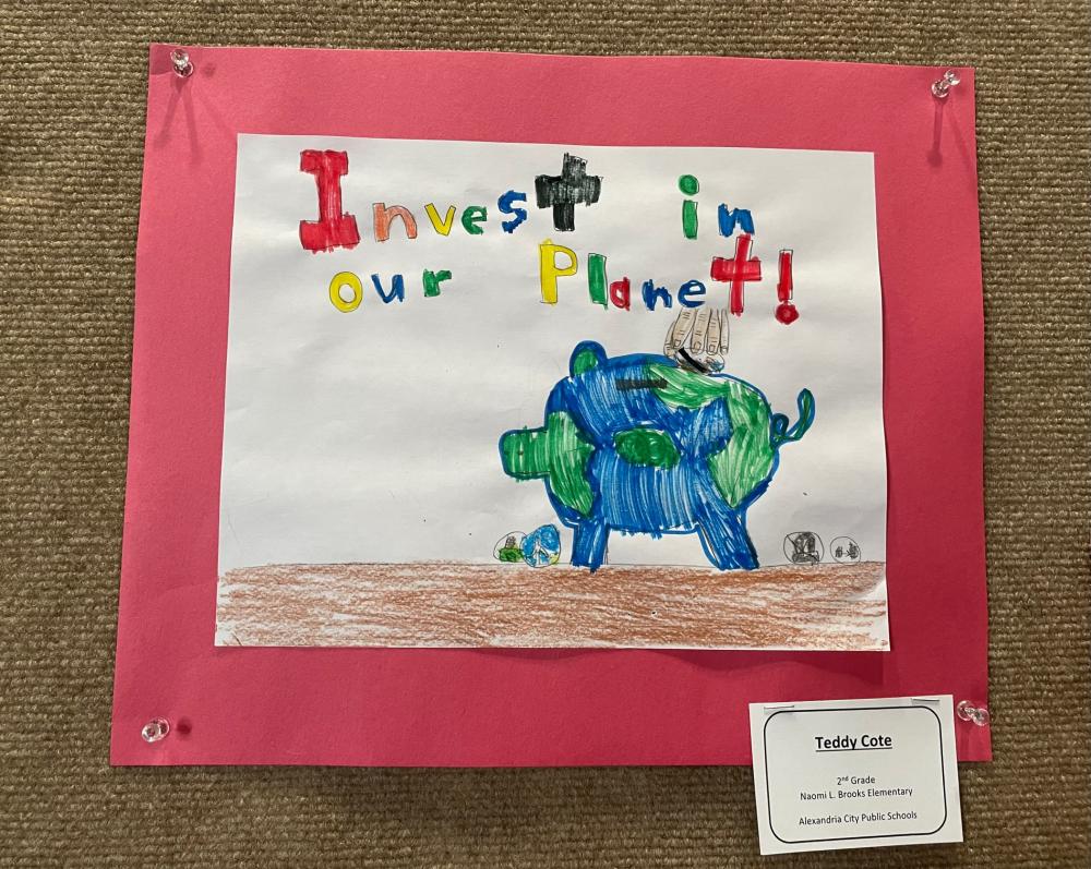 Earth Day student artwork depicting a globe in the shape of a piggy bank with text Invest in Our Planet